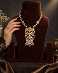 Jadau necklace featuring amethyst and pearls