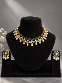 Traditional gold-toned jadau polki and pearl necklace set with green stones